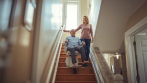 Senior using a stair lift inside a Toronto home to safely move between floors